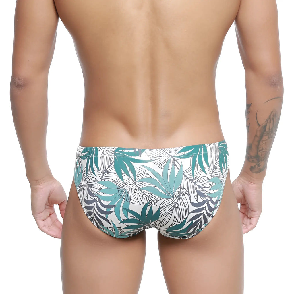 White swim trunks metro male wear meadow bikini 5103-56 with vibrant teal and dark gray tropical leaf pattern