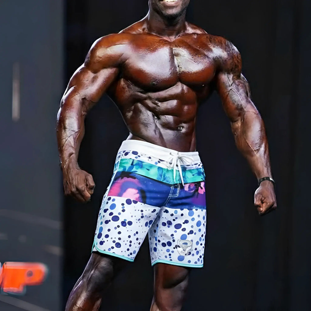 Vibrant patterned metro musclwear bubble physique board short in blue and white polka dots with teal trim