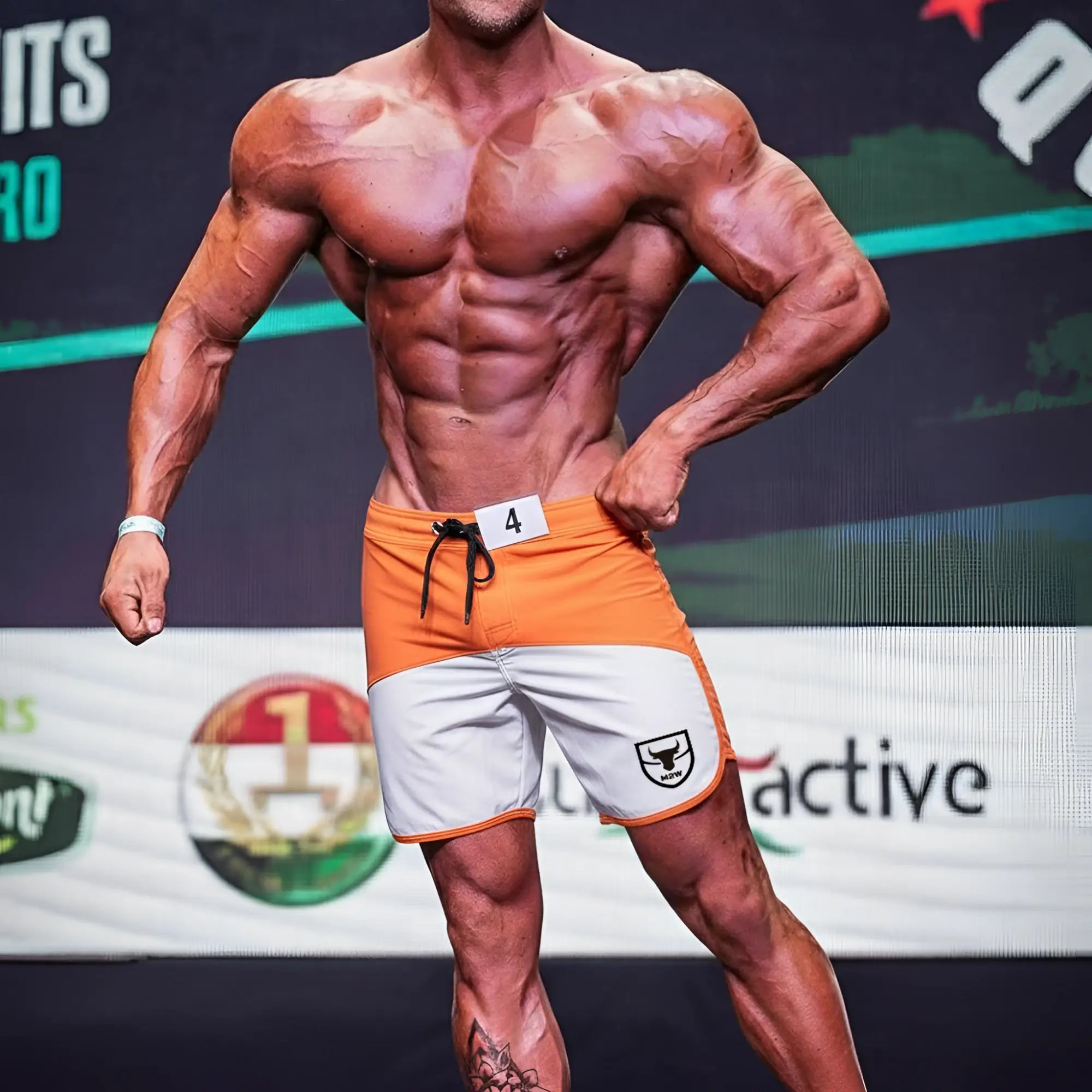Orange and white MetroMaleWear MetroMuscleWear Cordoba physique board shorts with black drawstring and shield logo