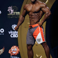 MetroMaleWear MetroMuscleWear IFBB Pro mens physique board shorts in gray orange white with black drawstring and shield logo