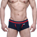 Navy blue MetroMaleWear Micro Mini Boxer briefs with red trim and a white logo on the waistband