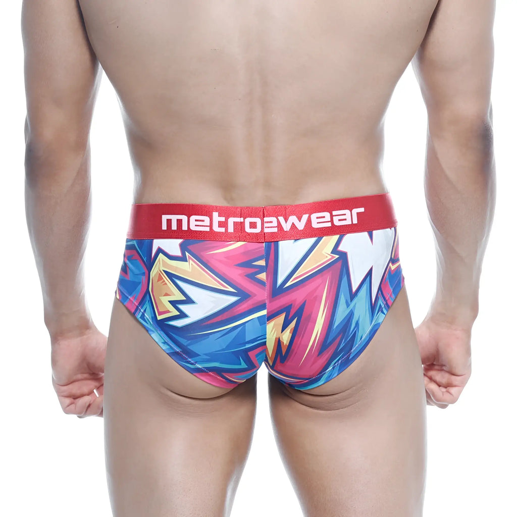 Vibrant graffiti-style men’s briefs in blue pink and yellow with red metro2wear waistband metro malewear mini cheek boxer