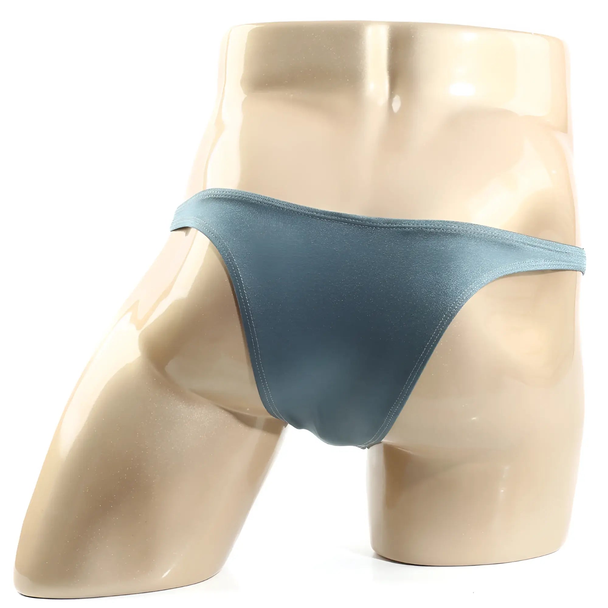 A sleek matte teal thong bikini from MetroMaleWear Monaco bikini moss 6010-17 made of smooth fabric