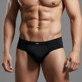 Black men’s briefs metroMalewear naked brief black 6303-20 with a subtle white logo on the waistband