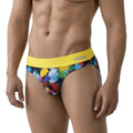 MetroMalewear Nasca brief yellow 6225-60 with vibrant abstract paint-splatter pattern and bold yellow annn logo waistband