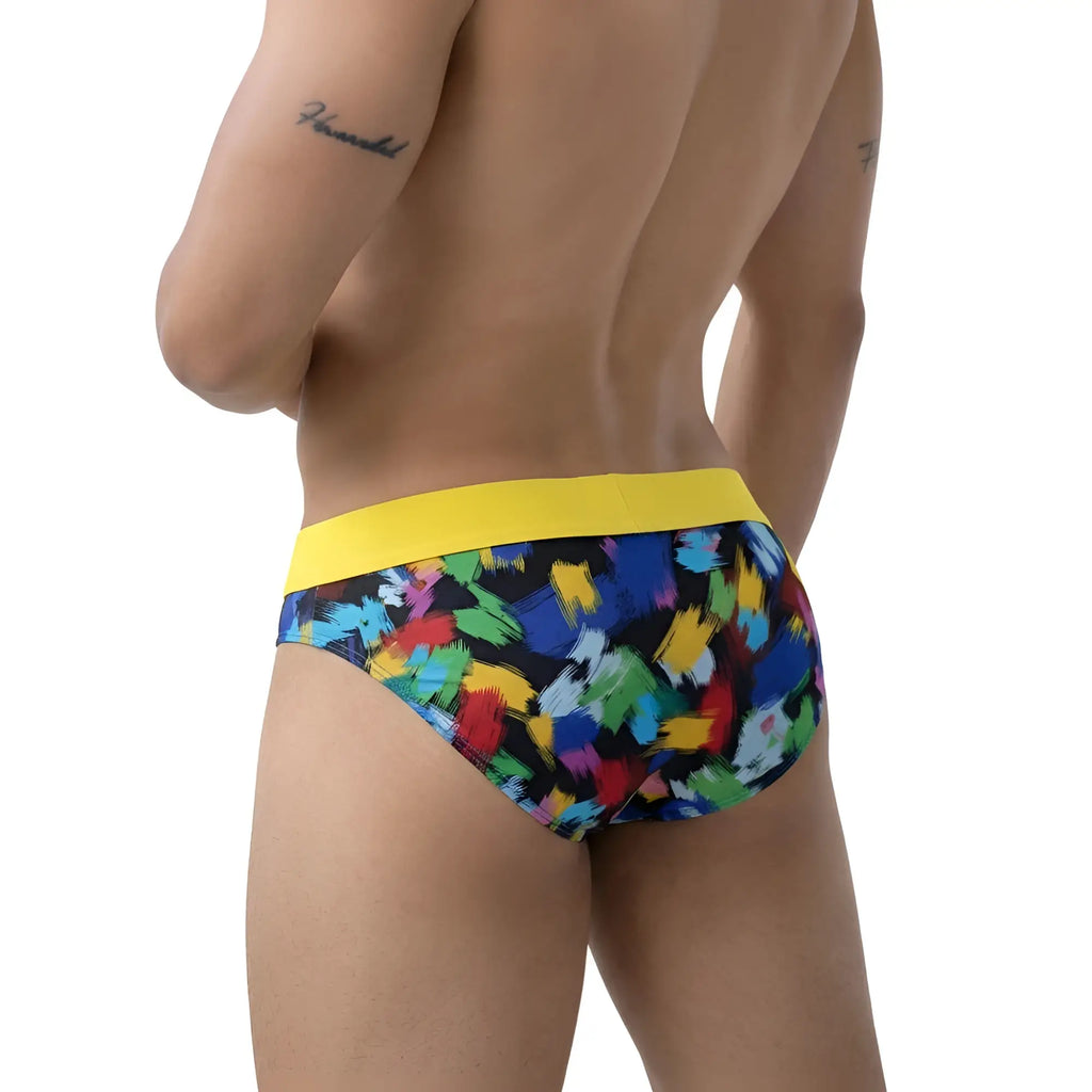 MetroMaleWear Nasca brief yellow with vibrant abstract paint-splatter pattern and bold yellow waistband in front view