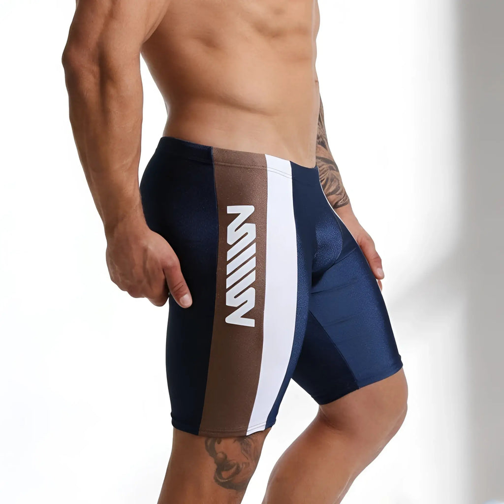 Navy blue and brown metroamalewear jammer swim boxer with white vertical stripe and bold m logo for athletic use