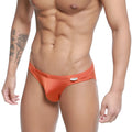 Orange satin MetroMaleWear ochre bikini briefs with a small white brand tag on the waistband