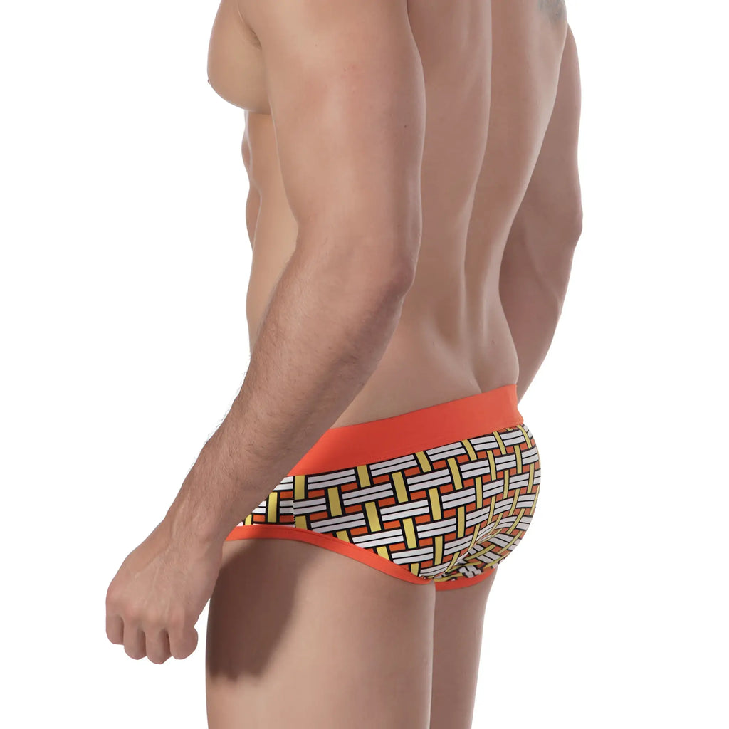 MetroMaleWear orange colander swim brief with orange trim and a white yellow black geometric basketweave pattern