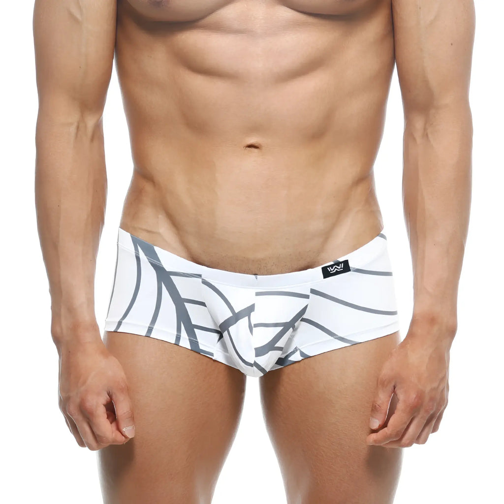 White swim trunks with bold gray abstract leaf pattern and black metro male wear logo on waistband front view