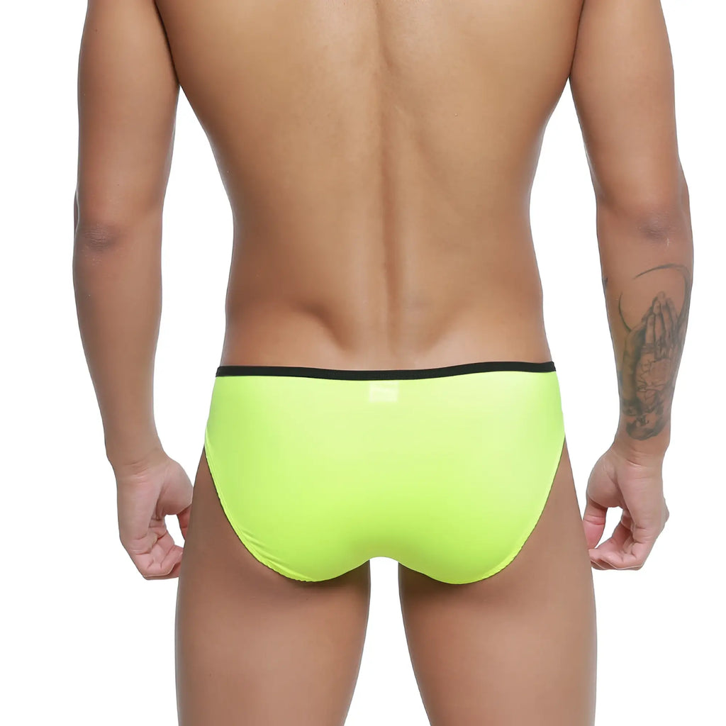 Bright neon green MetroMaleWear Over-Limit bikini swim trunks with a black waistband for stylish beachwear