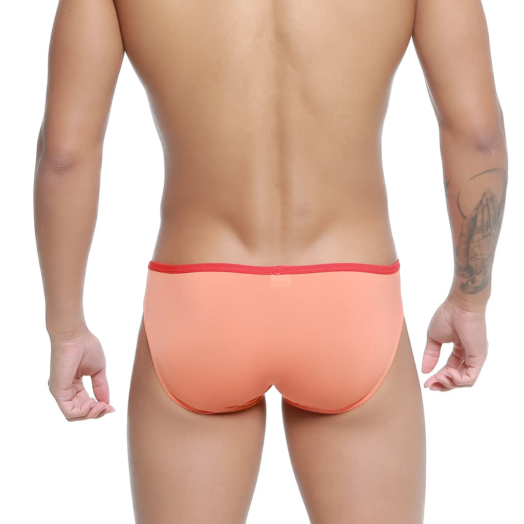 Coral-colored metroMalewear over-limit bikini briefs with red elastic waistband for comfortable daily wear