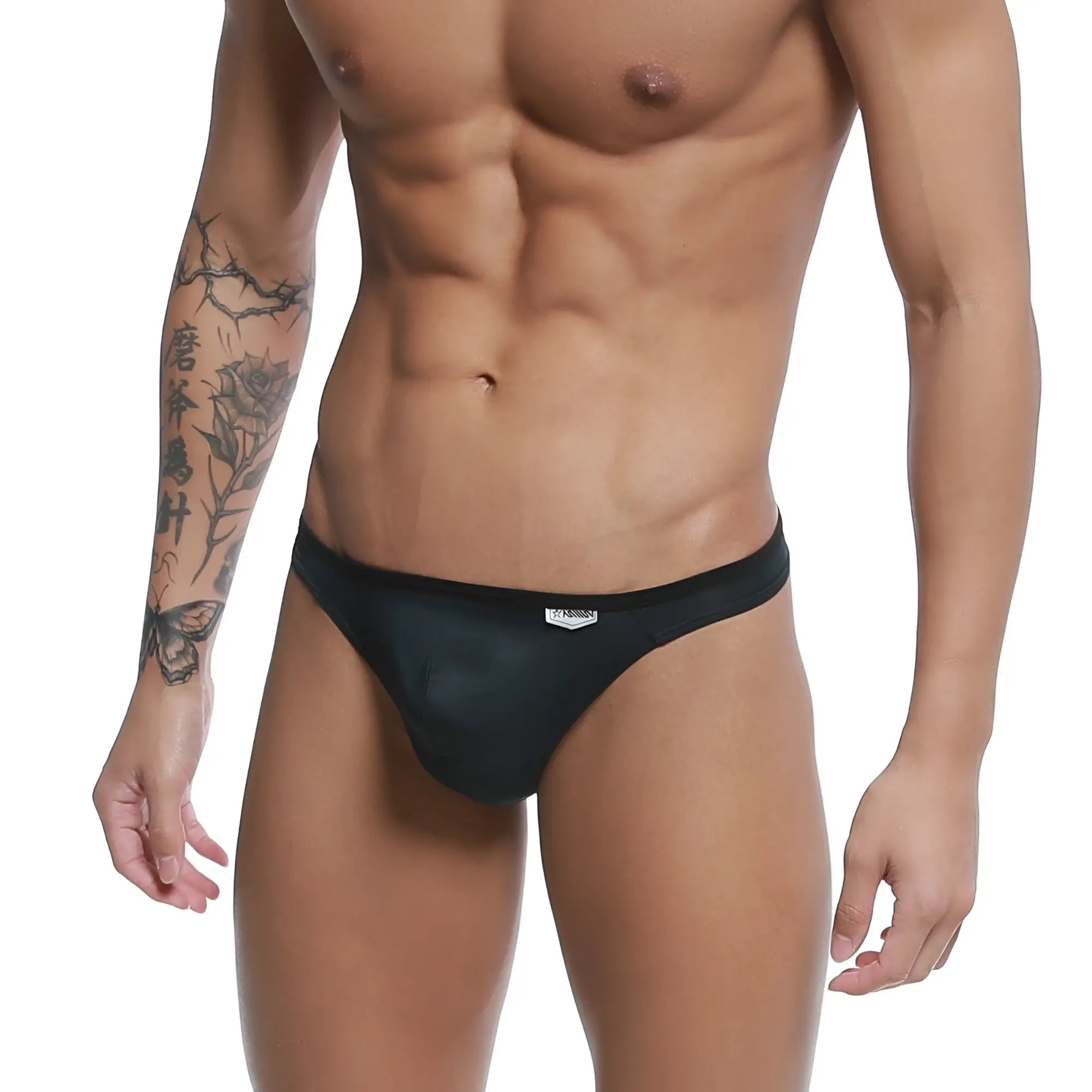 MetroMaleWear Over-Limit thong black mesh briefs with subtle sheen and small white logo on the waistband front side