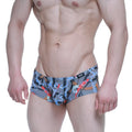Gray swim trunks by metromalewear featuring bold colorful chain and abstract graphic print for casual wear