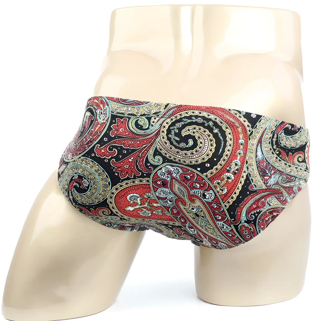 MetroMaleWear paisley bikini men’s briefs in vibrant red gold and teal paisley pattern displayed on a mannequin