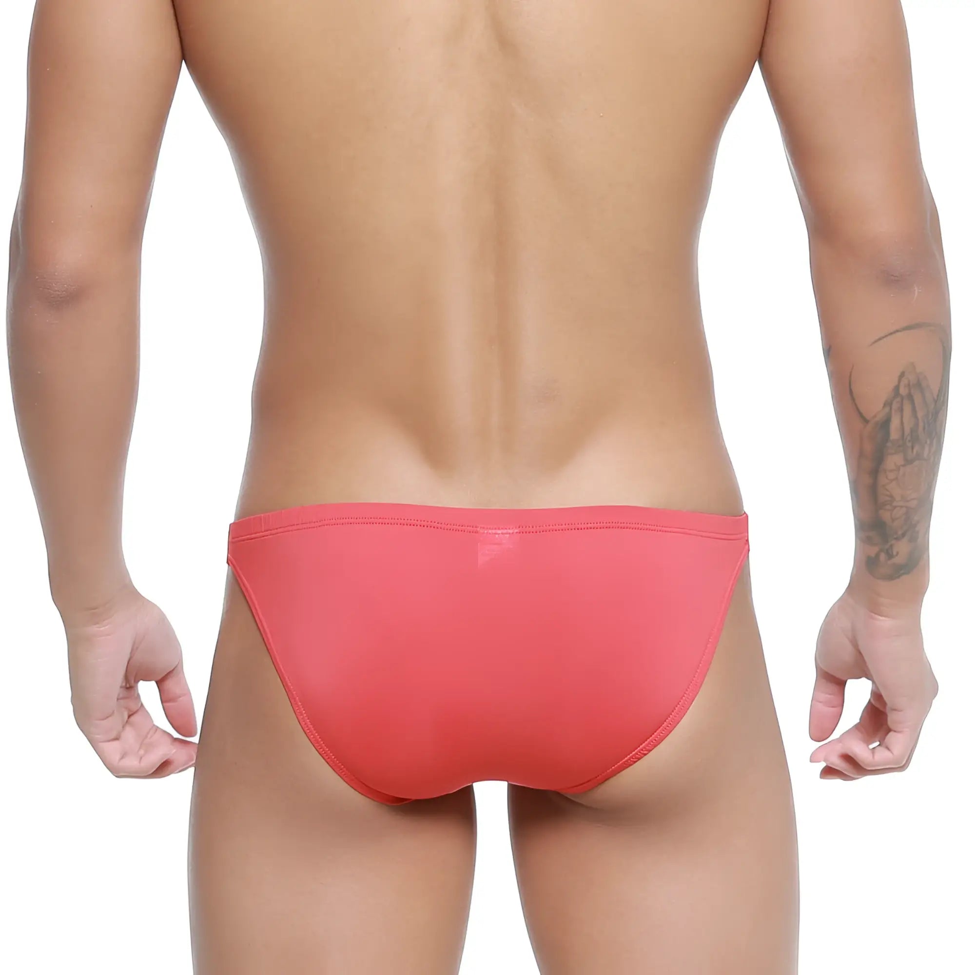 A sleek coral-red metro malewear paleta bikini swim trunk with a smooth form-fitting design for swimming