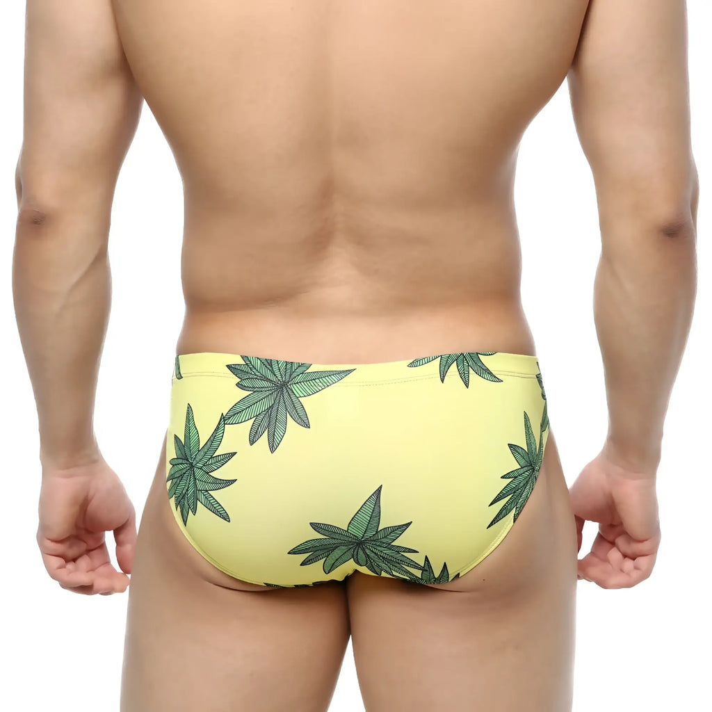 Yellow MetroMaleWear Palmera Bikini 5103-37 swim trunks with bold green cannabis leaf pattern for casual wear