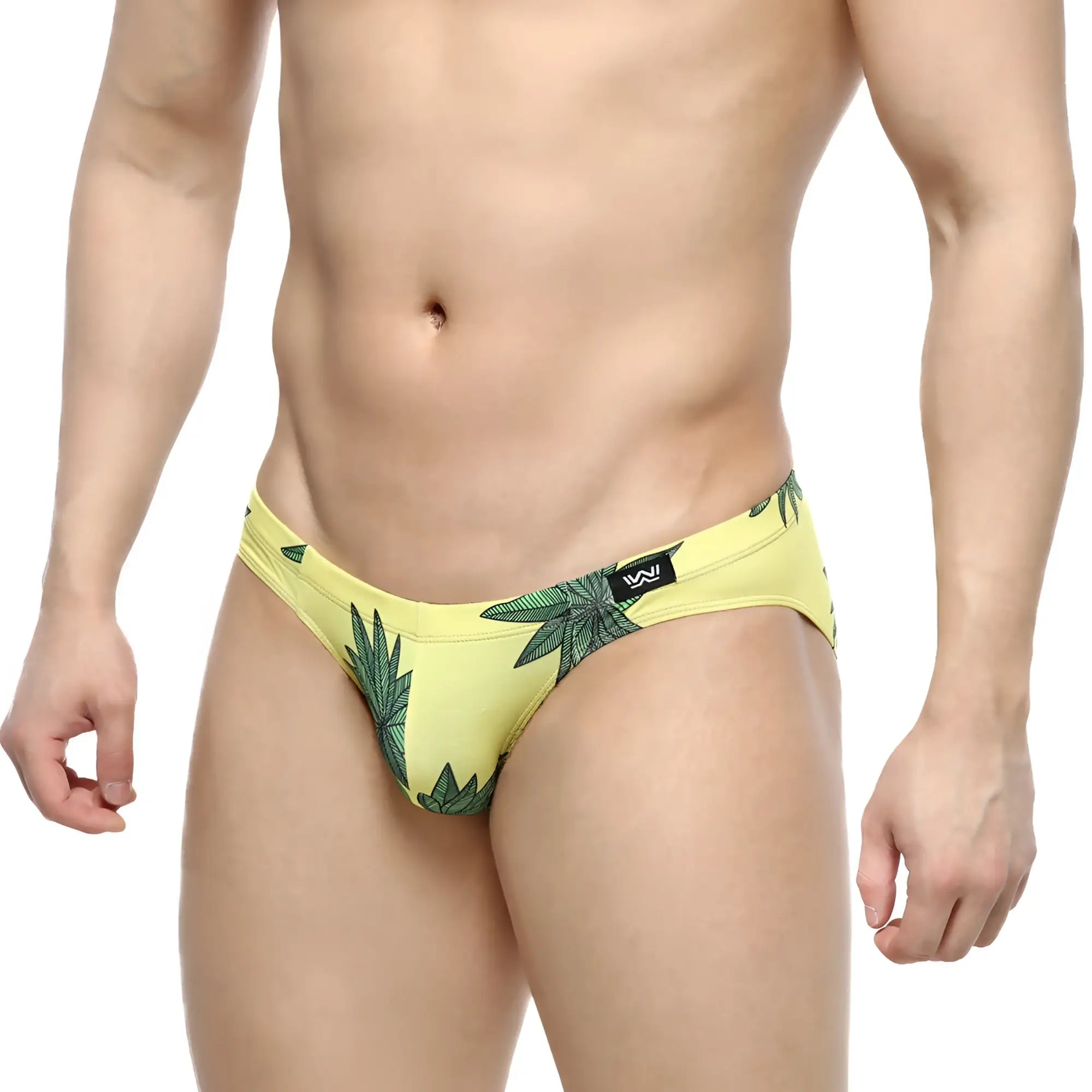 Yellow swim trunks with green leaf pattern and black logo waistband from MetroMaleWear Palmera Bikini 5103-37