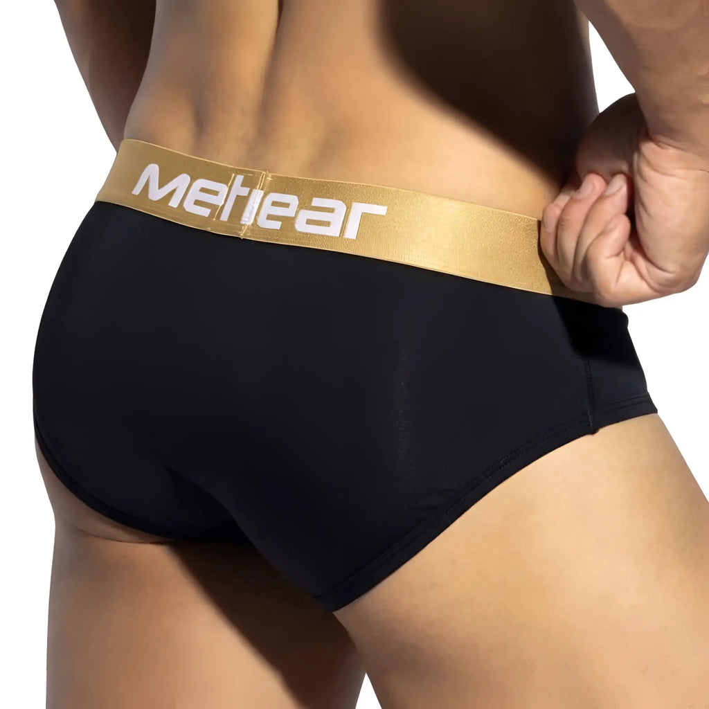 Black MetroMaleWear panel bikini briefs with gold waistband and white lettering in breathable fabric