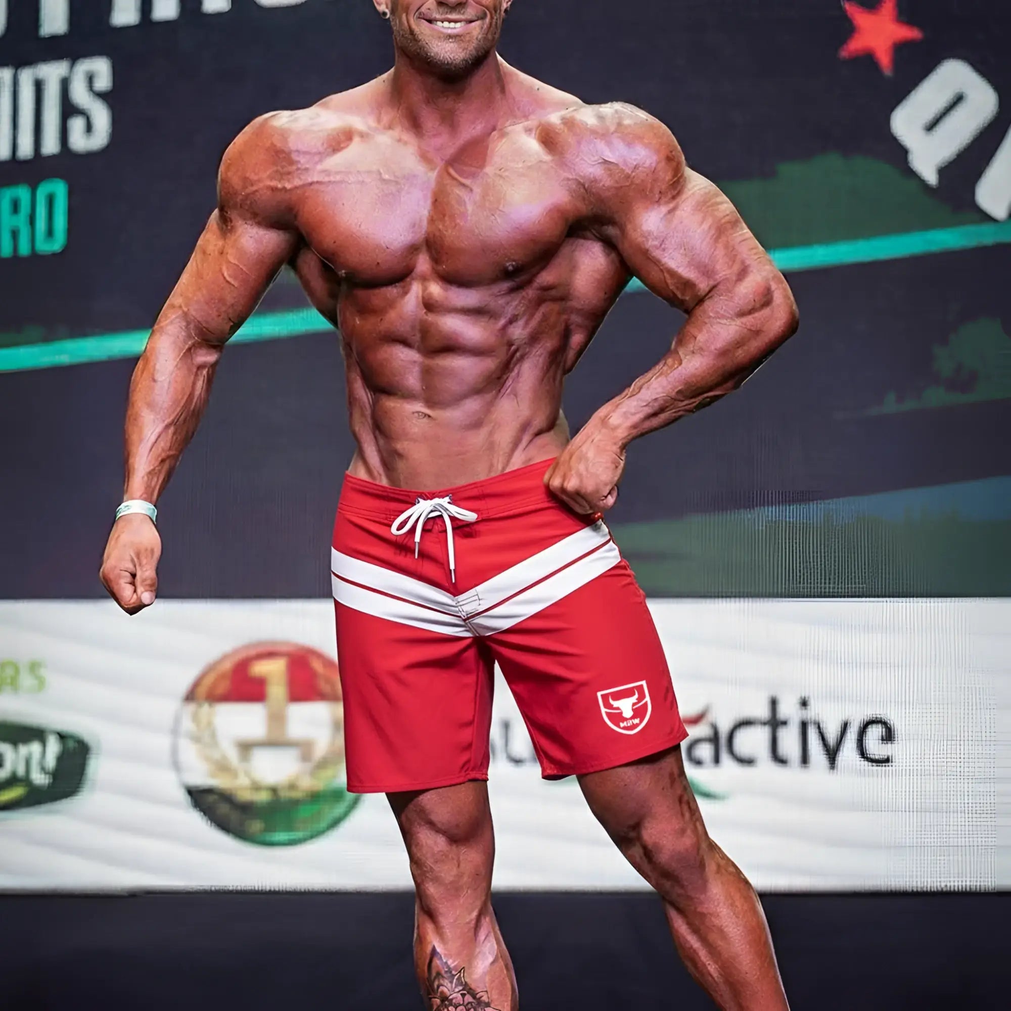 Red athletic shorts with white stripes and bull logo on the left leg by Metromalewear Physique Board Short Crimson 4706-13