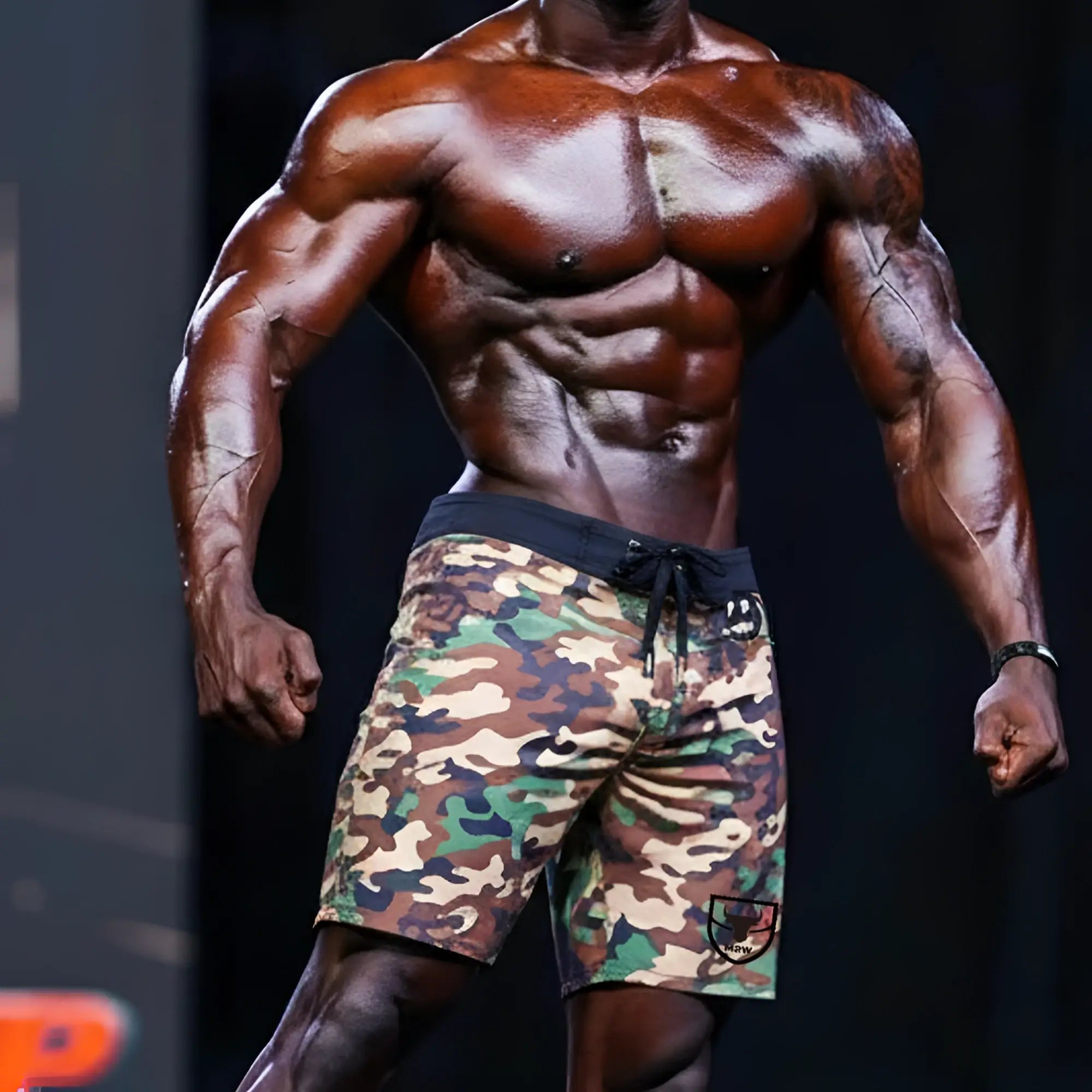 MetroMaleWear physique board short green camo with black drawstring waistband and logo patch on lower right leg