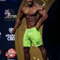MetroMaleWear physique board short neon green with white drawstring and black shield logo on the lower right leg