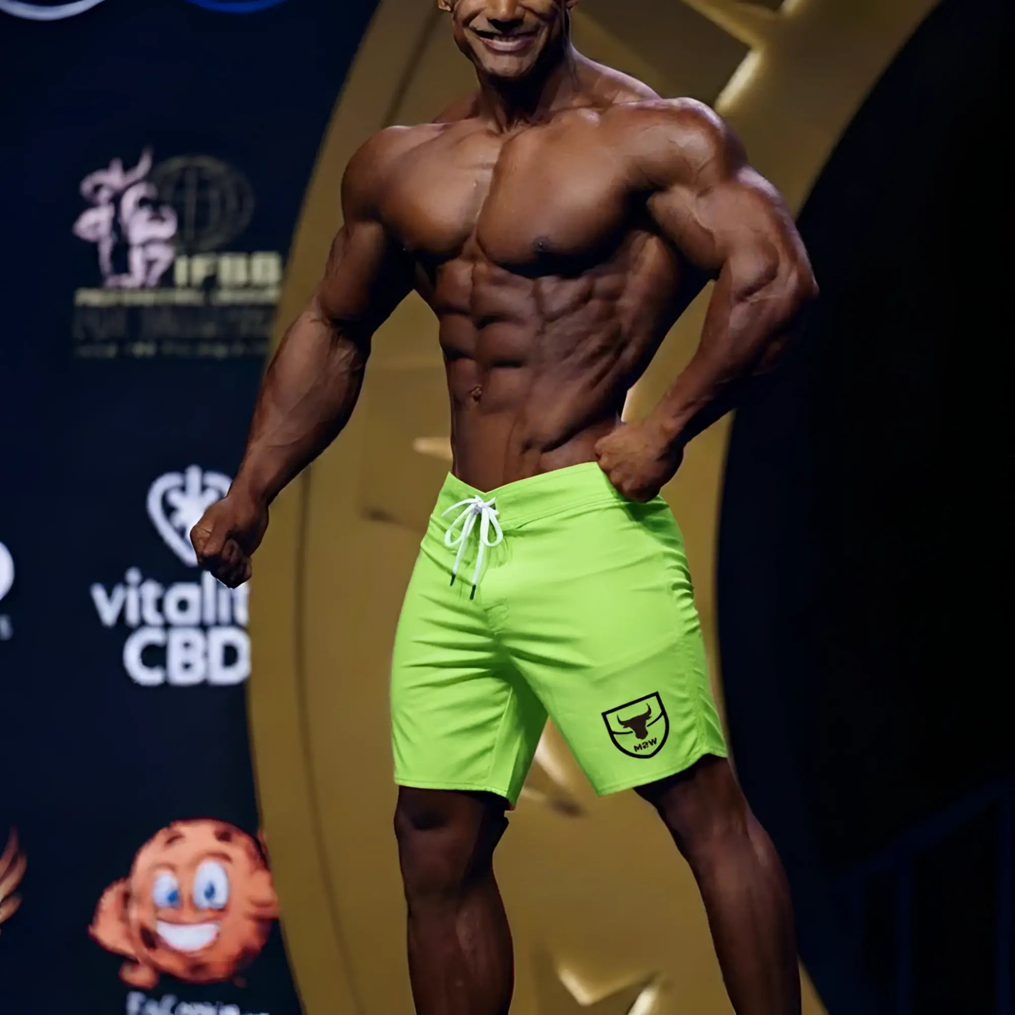 MetroMaleWear physique board short neon green with white drawstring and black shield logo on the lower right leg
