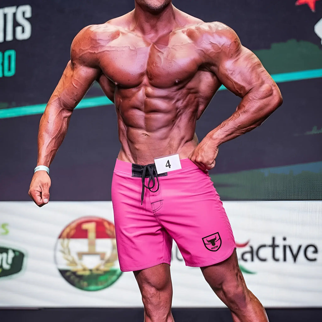 Metro male wear physique board short pink with black drawstring waistband and shield logo on lower right leg