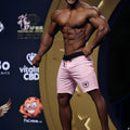 Pink metroMalewear physique board short with black drawstring waistband and small shield logo on lower left leg