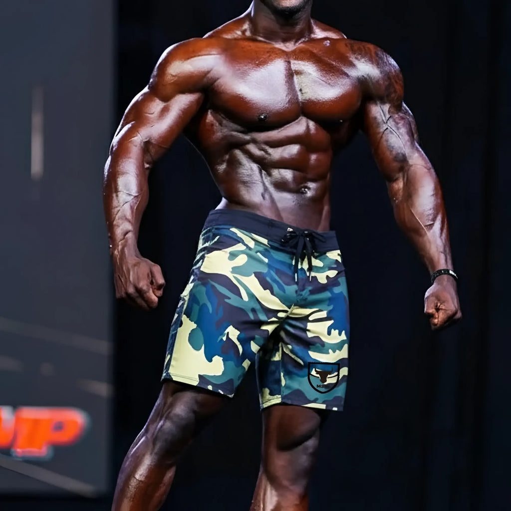 MetroMaleWear physique board short yellow camo with black drawstring waistband and logo patch on lower left leg