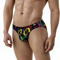 Black swim trunks MetroMaleWear Pinaculo Bikini 5103-M85 with vibrant neon pink yellow green and red graffiti graphic