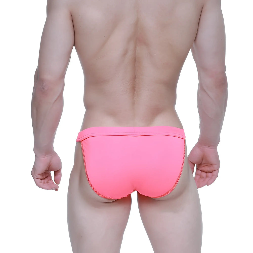 Bright pink metroMalewear plano bikini swim trunks with snug fit and side seam zipper detail for men