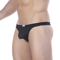 Black form-fitting men’s MetroMaleWear pouch thong 2302-20 with smooth fabric waistband and small red logo tag