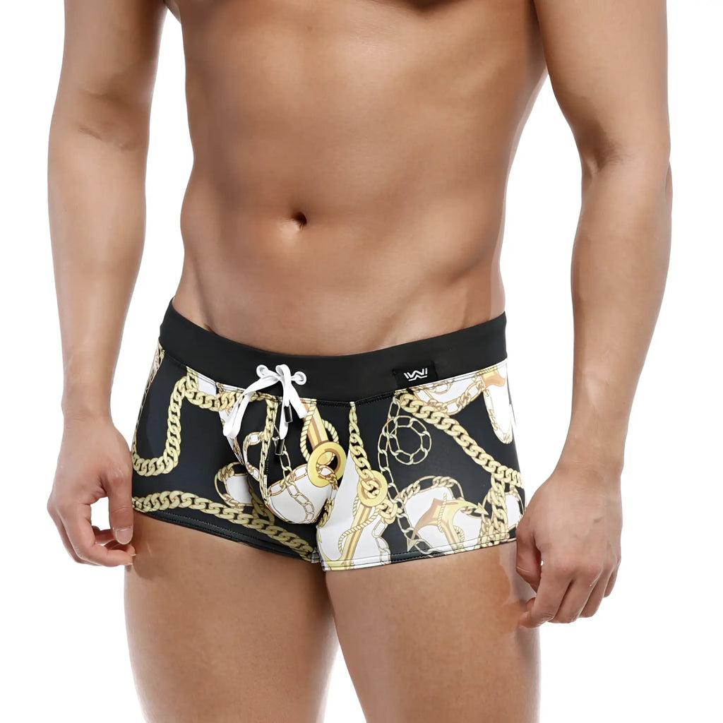 Black MetroMaleWear Profundo swim boxer briefs with bold gold and white chain pattern and black waistband