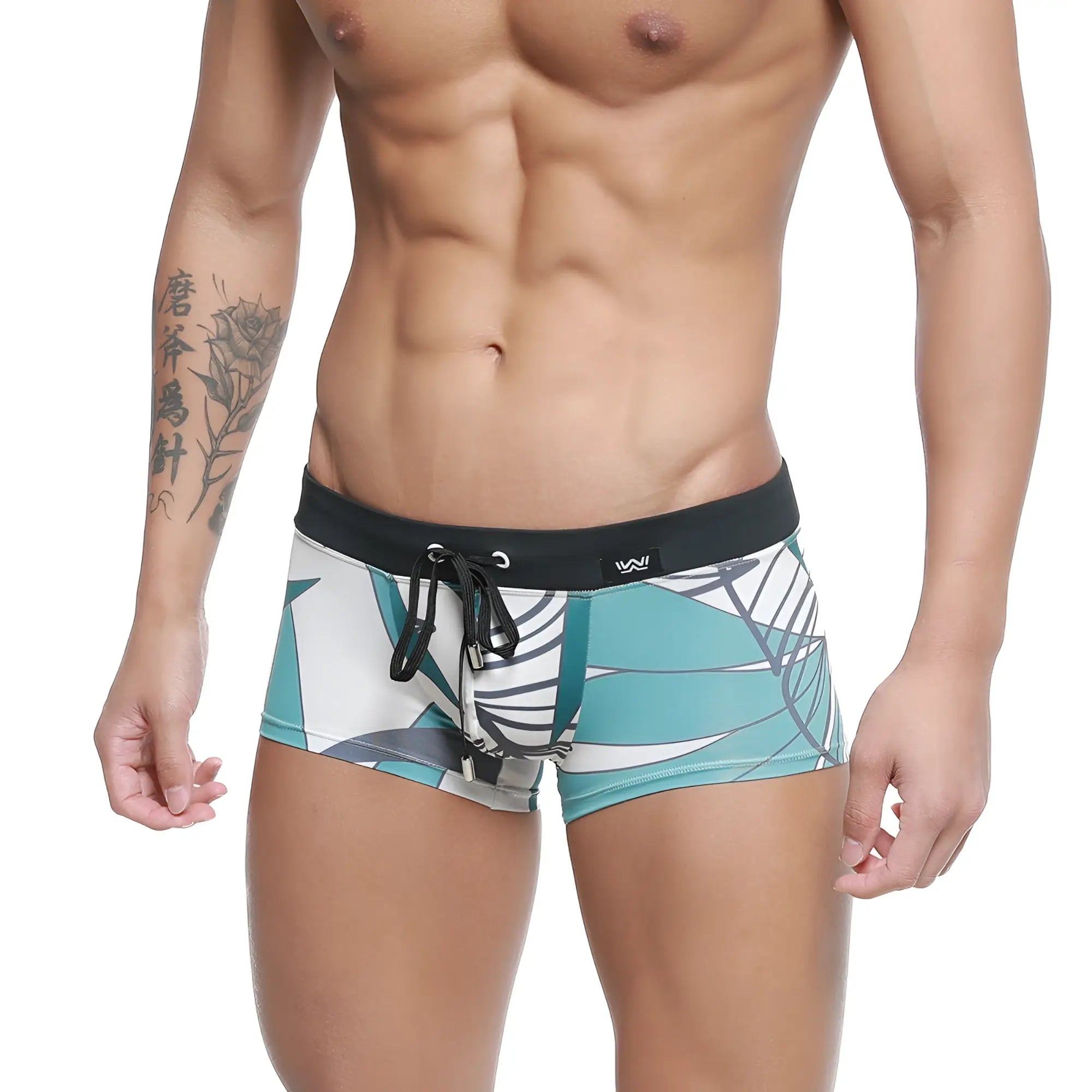 Tealmalewear profundo swim boxer briefs meadow 4986-09 in teal and white tropical leaf pattern with black elastic waistband