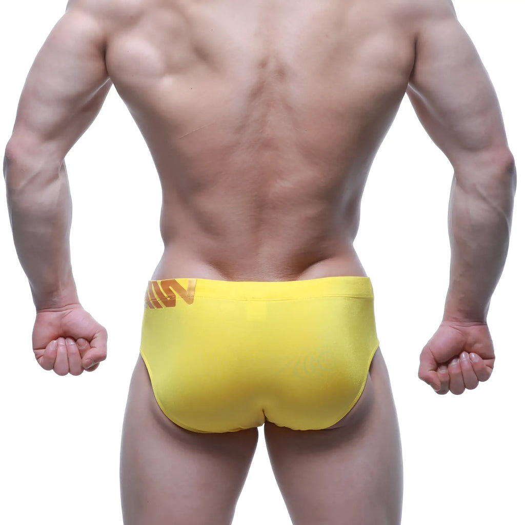 Bright yellow MetroMaleWear Rubio Swim Brief 4966-15 with a subtle orange logo on the waistband for athletic use