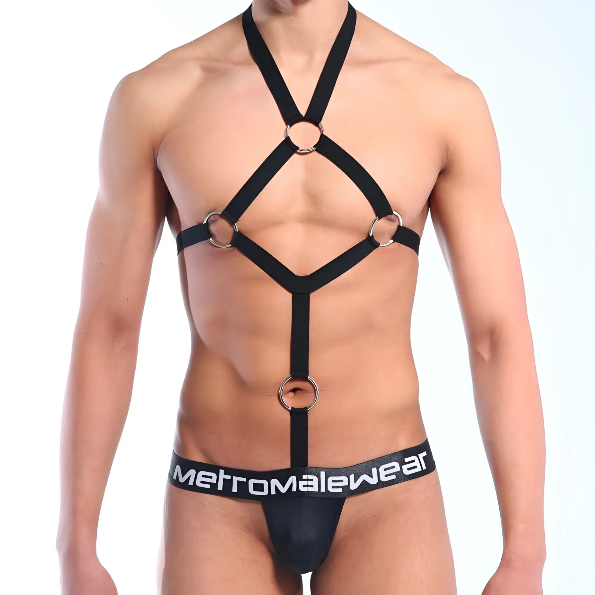 Black harness-style bodysuit with silver metal rings and adjustable straps featuring MetroMaleWear branded waistband