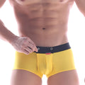 Bright yellow mens briefs with black waistband silver grommets and red brand tag metro male wear snap trunk mango 2223-15