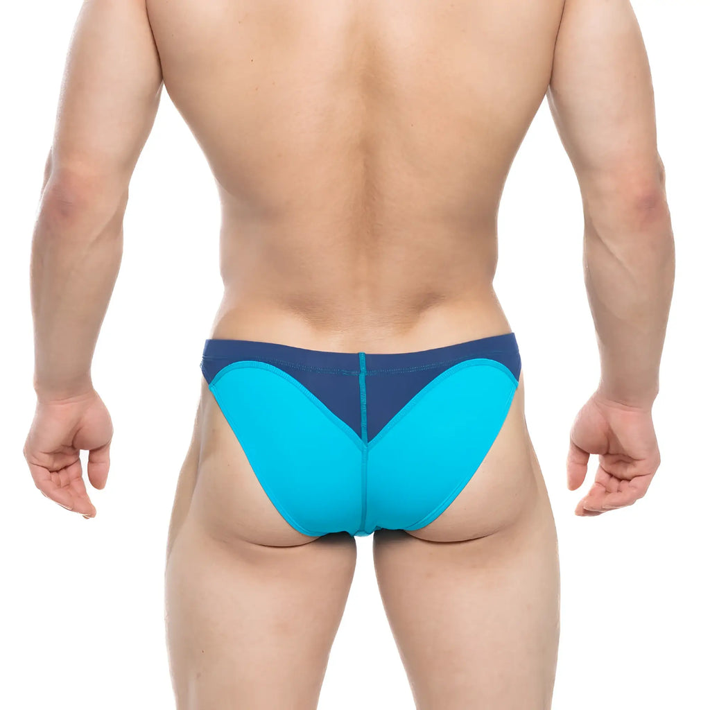 Bright turquoise and navy blue athletic briefs with a sleek form-fitting design by MetroMaleWear Splash Swim Bikini