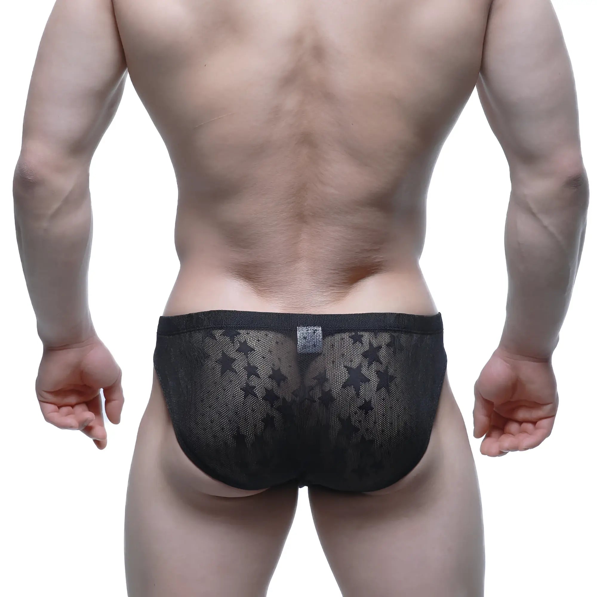 Black star patterned mesh briefs metro male wear stardust bikini in black showcasing front view