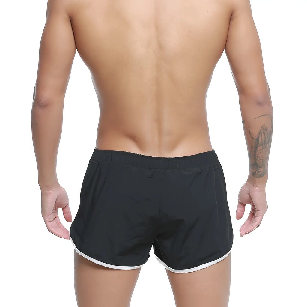 Black MetroMaleWear summer swim shorts with white trim along the hem designed for athletic use
