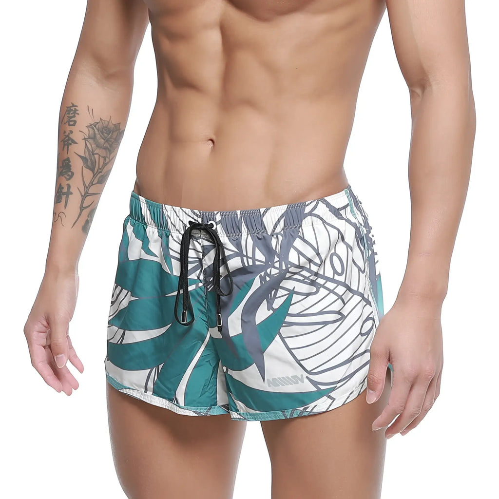 MetroMaleWear summer swim shorts meadow 4988-09 feature teal and white tropical leaf pattern with black drawstring waistband