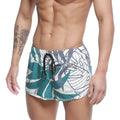 MetroMaleWear summer swim shorts meadow 4988-09 feature teal and white tropical leaf pattern with black drawstring waistband