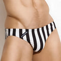 Black and white vertically striped men’s swim trunks with branded tag on the side from MetroMaleWear TERMOLI collection