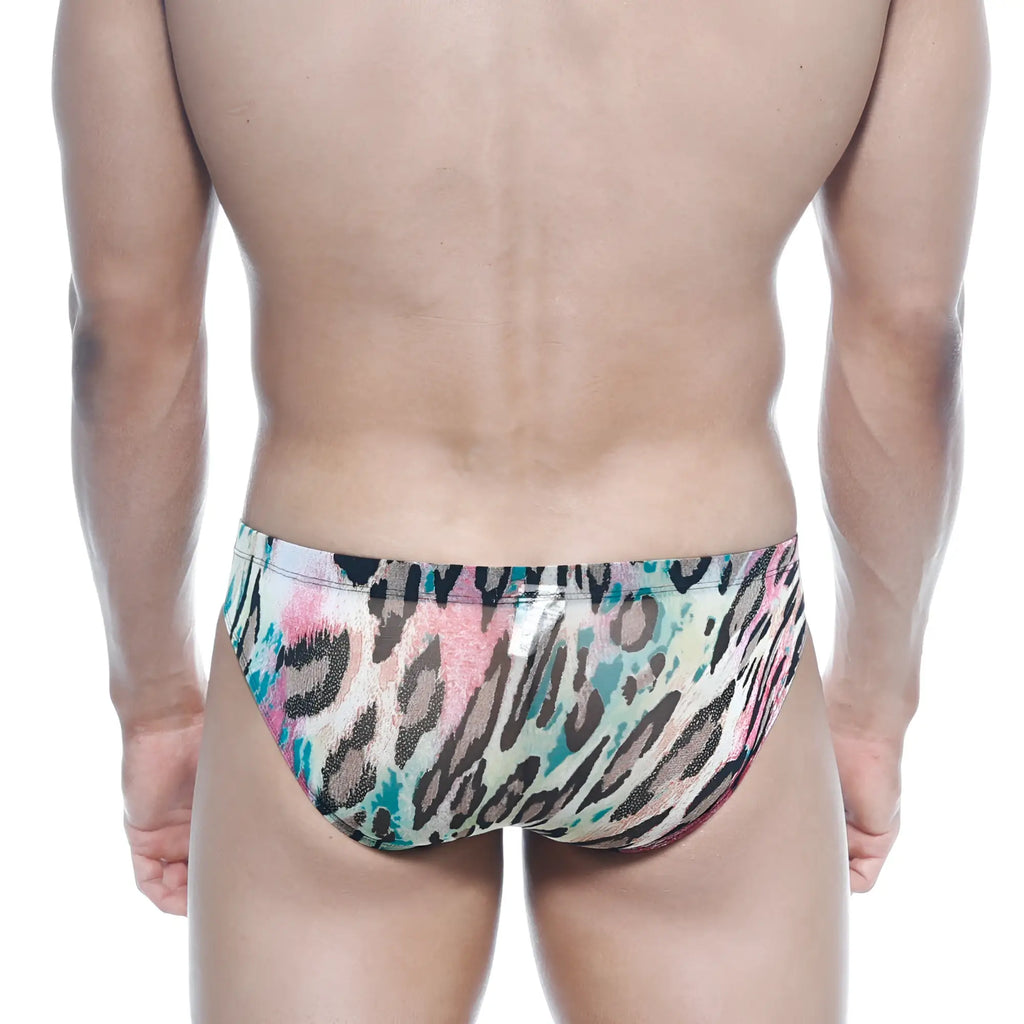 Vibrant multicolored leopard-print swim trunks by metromalewear with bold pink teal and black pattern on beige base