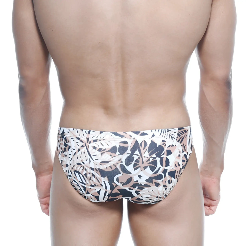 MetroMalewear vasco hip brief hoja swim trunks with bold black white and beige tropical leaf pattern for men