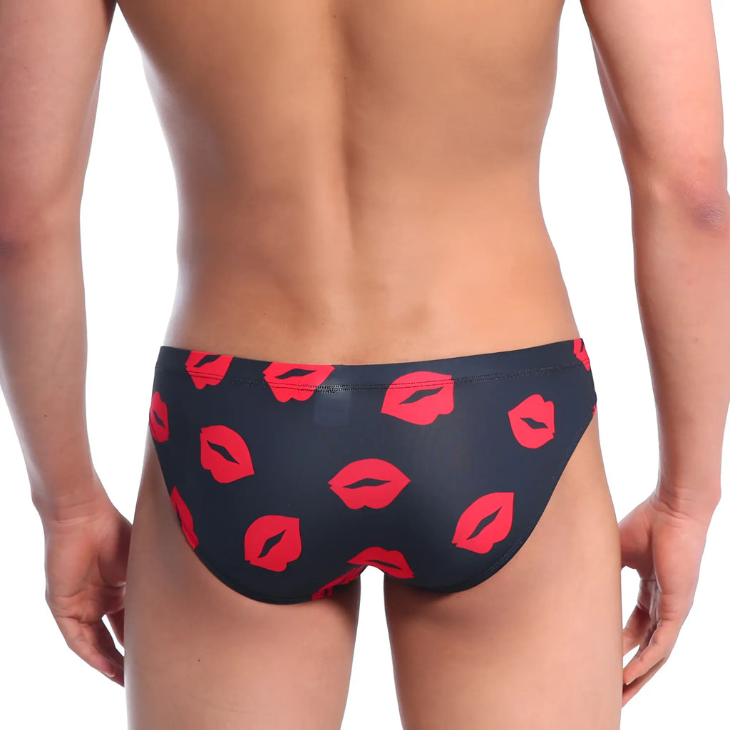Black metro malewear vasco hip brief swim trunks with bold red lipstick print for stylish beachwear