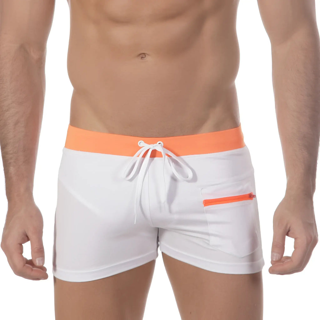 White swim trunks with bright orange waistband and zipper pocket featuring white drawstrings metro malewear zip swim boxer