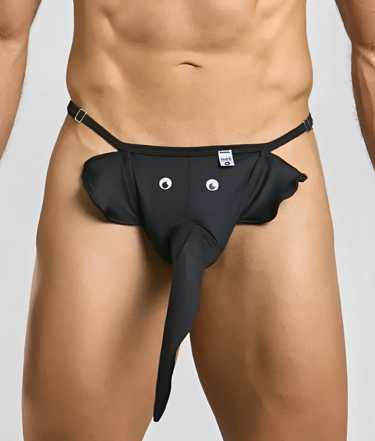 Black elephant thong with googly eyes, long trunk, and adjustable straps designed for playful intimate wear