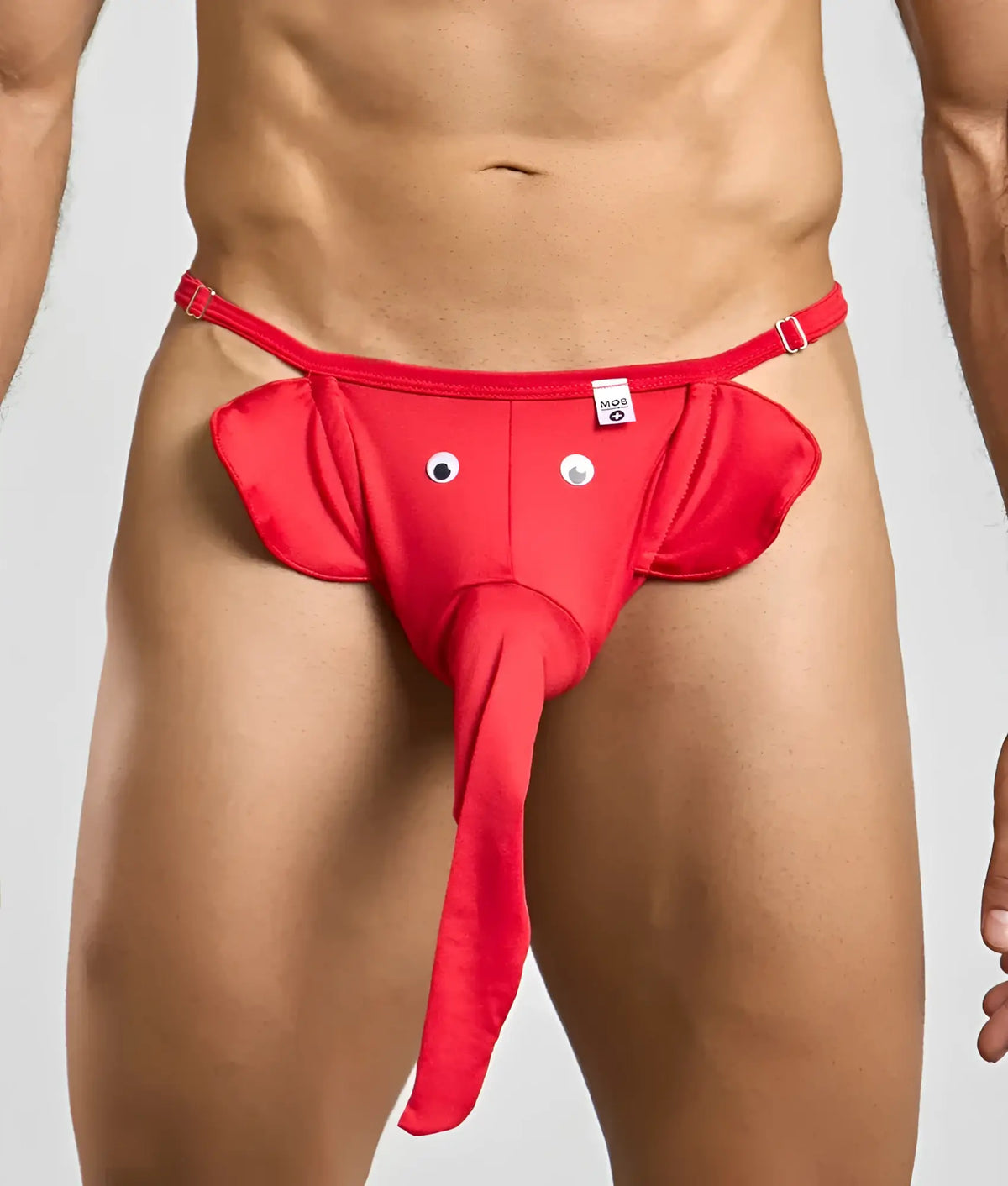 Red elephant thong with googly eyes and long trunk made of stretchy fabric for playful wear